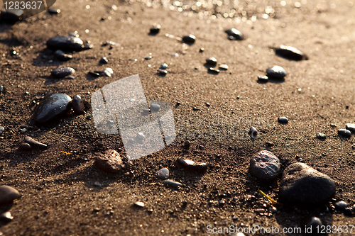 Image of Sand. Perissa beach, Santorini, Greece