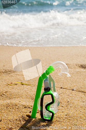 Image of Snorkel and mask in sand