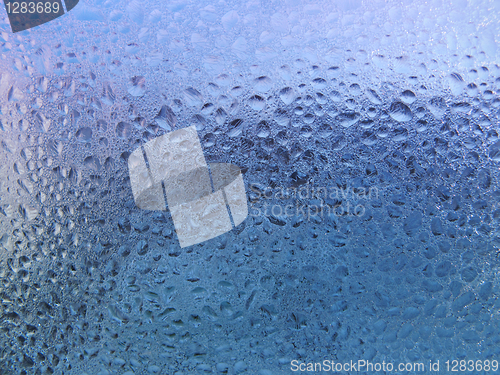 Image of frosted water drops on glass
