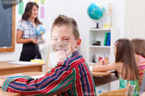 Image of Cheerful young boy in school