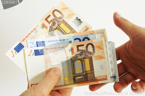 Image of Handing Euros