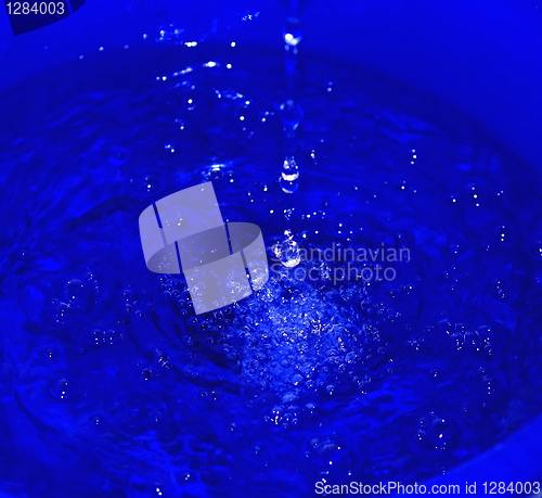 Image of water droplets on a blue background