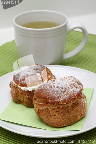 Image of Two profiteroles and tea