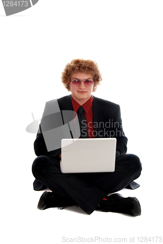 Image of Businessman sitting with Laptop
