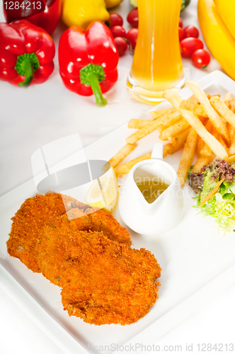 Image of classic Milanese veal cutlets and vegetables