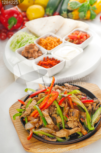 Image of original fajita sizzling hot  on iron plate