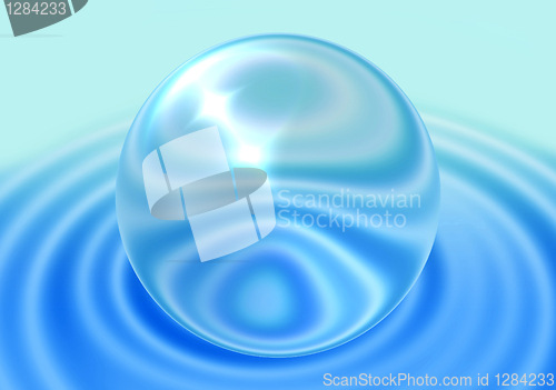 Image of transparent sphere on blue ripple background