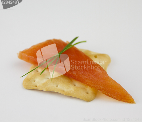 Image of smoked salmon on a cracker