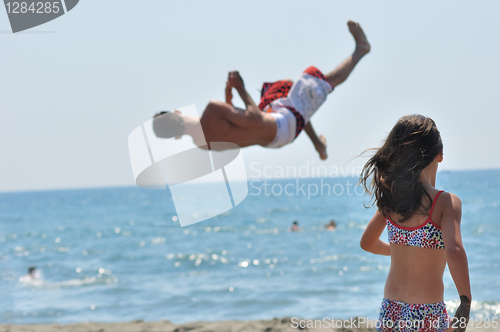 Image of Young on beach