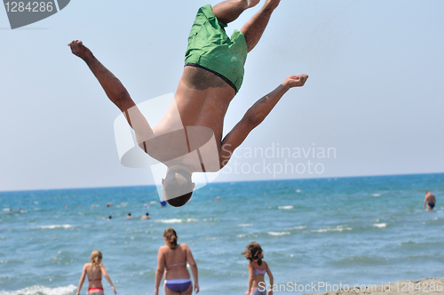 Image of Young on beach