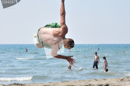 Image of Young on beach