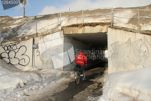 Image of man under bridge