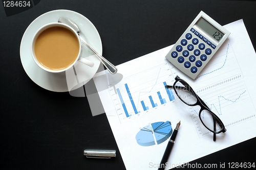 Image of coffee and financial data