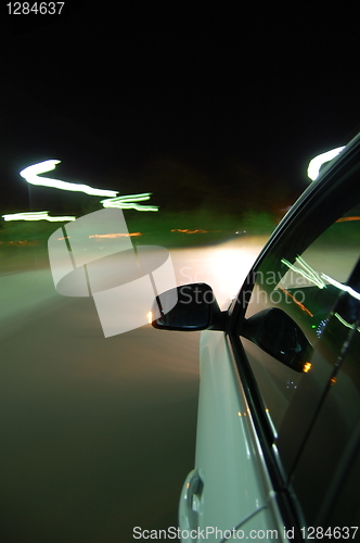 Image of night drive with car in motion 