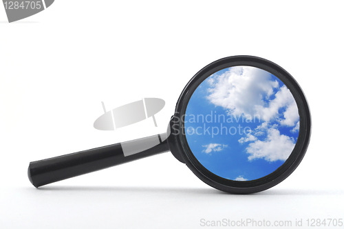 Image of blue sky and magnifying glass