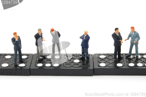 Image of business man on domino 