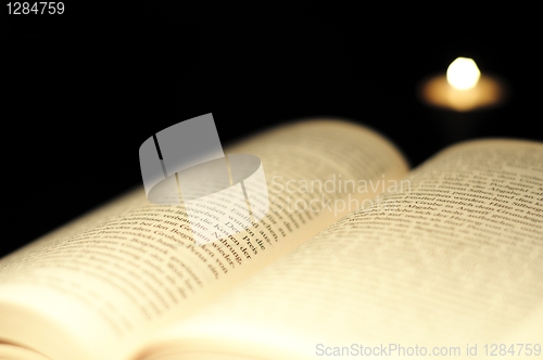 Image of book and candle