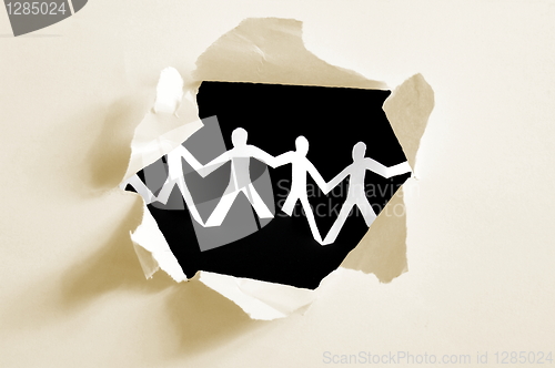 Image of paper man in a hole