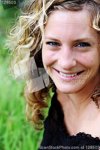 Image of Portrait of a gorgeous woman at the park