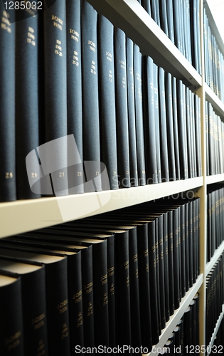 Image of old books in a library