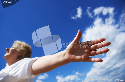 Image of Free woman on the sky background