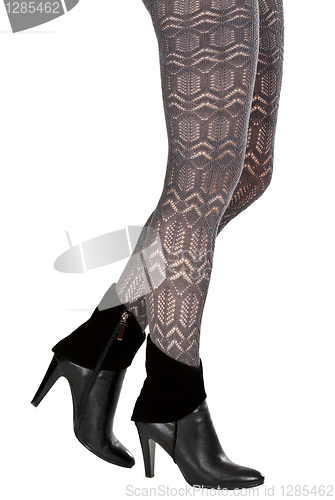 Image of shapely female legs in pantyhose and shoes