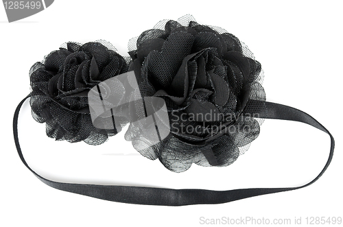 Image of black fabric flower with crystals