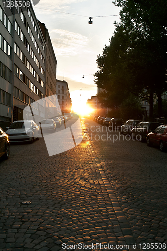 Image of European narrow street with parked cars