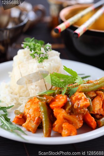 Image of Red chicken curry stripes with rice