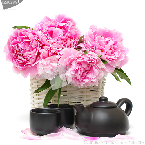 Image of Chinese tea set and pink peony flower isolated on white