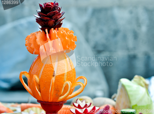 Image of a stylized vase of the citrus fruits