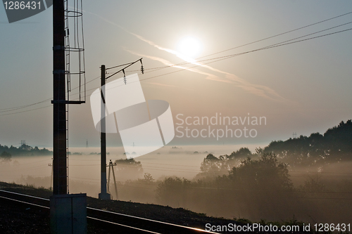 Image of Sunrise over a misty meadow