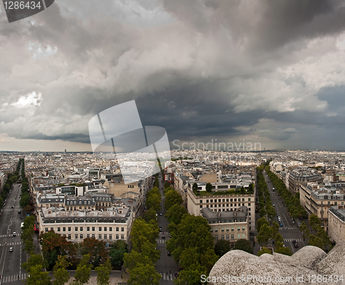 Image of Aerial view of Paris with stormy clouds