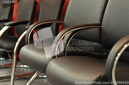 Image of black leather office chair close-up