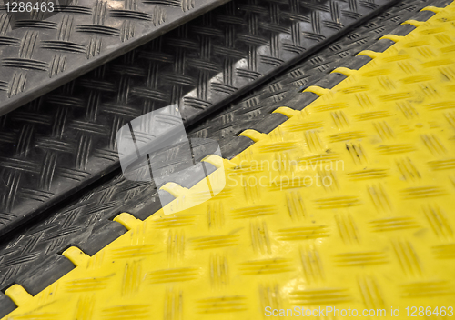 Image of black-yellow speed bumps Humps