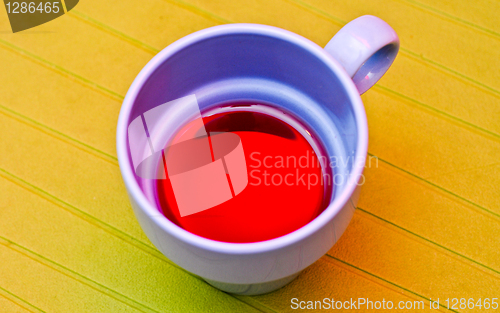 Image of Blue cup with a compote on the green napkin