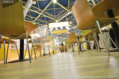 Image of Chairs stand on the floor