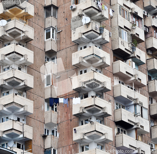 Image of close-up on the wall with the windows of an apartment house