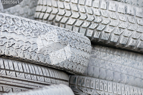 Image of close-up. the white automobile tires dumped in a a big pile