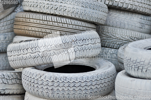 Image of close-up. the white automobile tires dumped in a a big pile