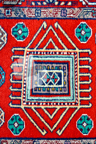 Image of colored wool handmade carpet closeup