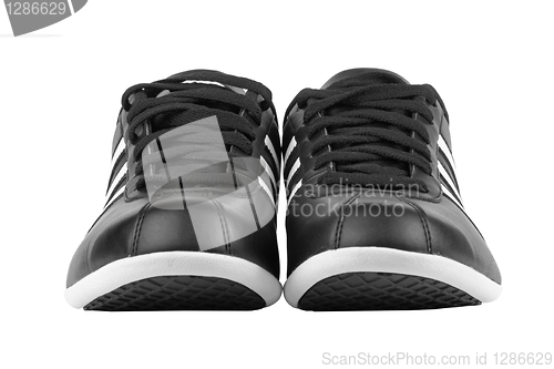 Image of Black sneakers with white strips
