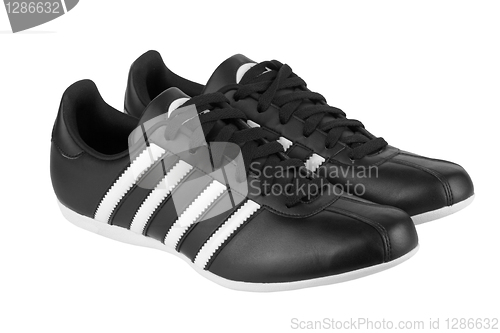 Image of Black sneakers with white strips