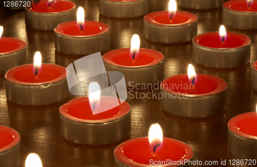 Image of candles in darkness