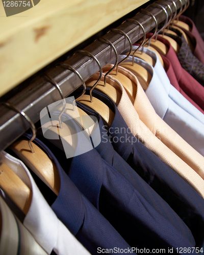 Image of clothes hanger man's shirts 