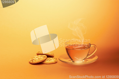 Image of Cup of hot tea with chocolate cookies