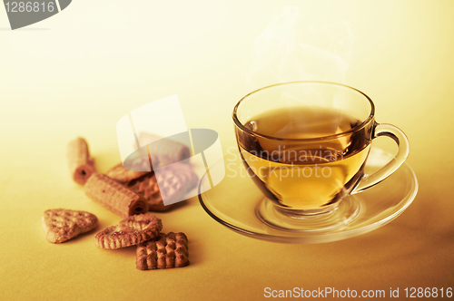 Image of Cup of hot tea with cookies