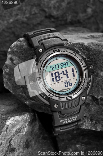 Image of Electronic waterproof watch on grey stones