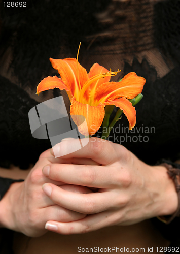 Image of Holding a flower