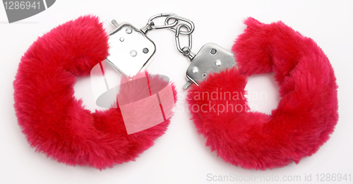 Image of fluffy pink handcuffs